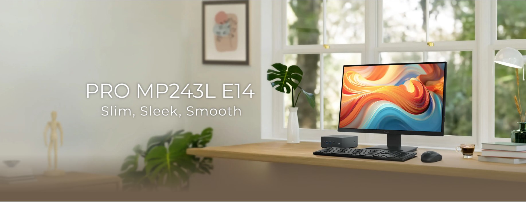 MSI MP243L E12 monitor displaying a colorful screen on a modern wooden desk setup
